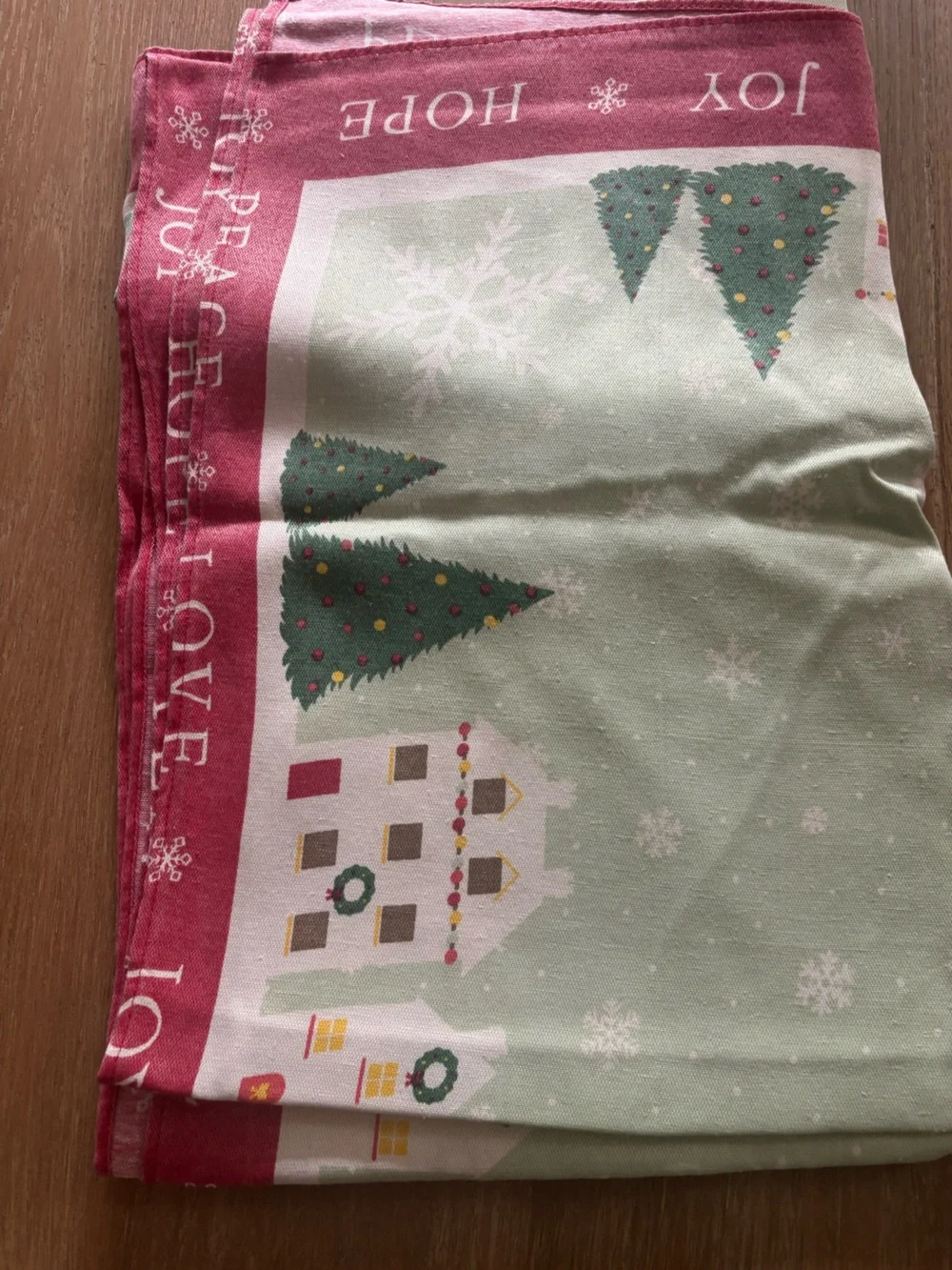St. Nicholas Square Holiday Village Table cloth in Red, Green, White